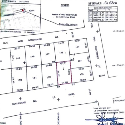 1 lot cloturé avec titre foncier au bord du boulevard de la kara