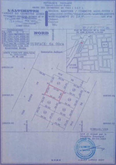 1 lot avec titre foncier en cours au bord du goudron