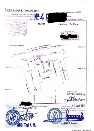 démi lot cloturé avec titre foncier au bord de la grande voie
