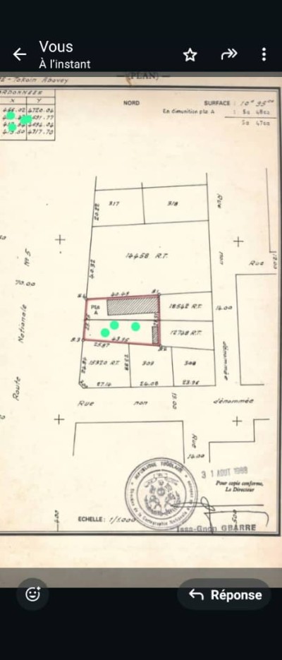 1 lot cloturé avec titre foncier au bord du goudron