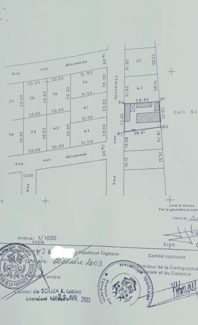 1 lot avec titre foncier juste à coté de la caisse