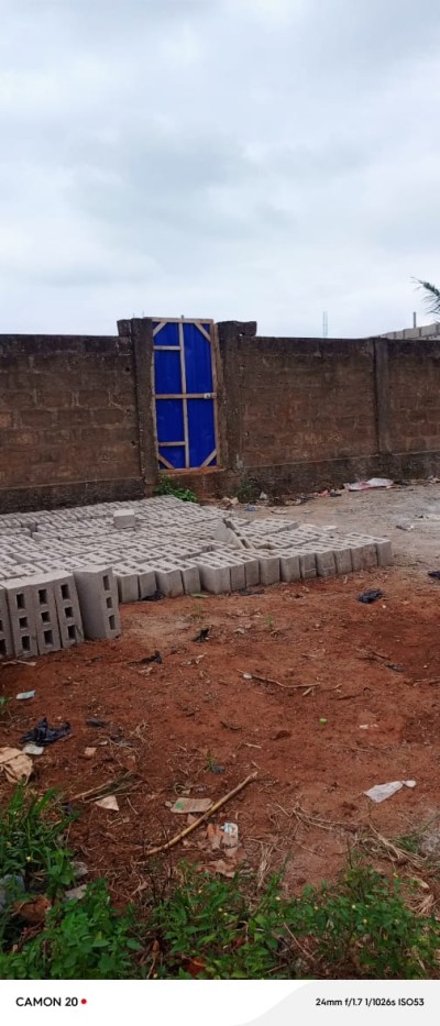 2 lots cloturés avec titre foncier global à 80m du goudron