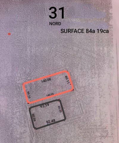 23 lots cloturés avec titre foncier à 100m de la grande voie