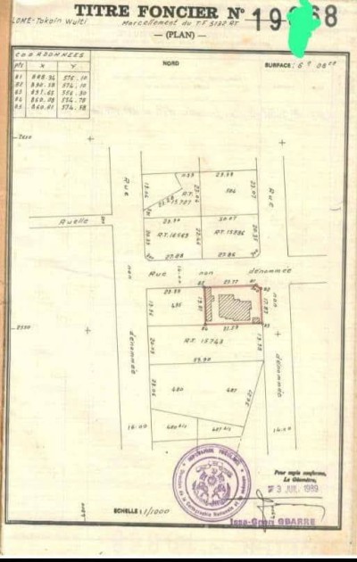 1 lot cloturé avec titre foncier à 250m du goudron