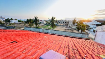 4 lots cloturés avec titre foncier  à 100m du goudron