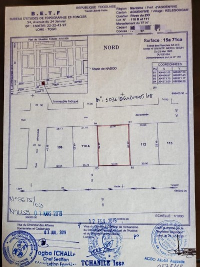 2 lots et démi  avec titre foncier en cours au bord du goudron
