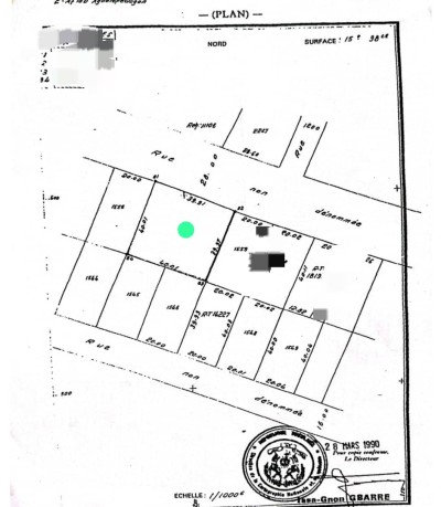 1 lot et démi avec titre foncier au bord du goudron