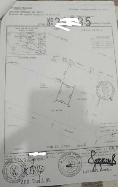 1 lot cloturé avec titre foncier au bord du goudron