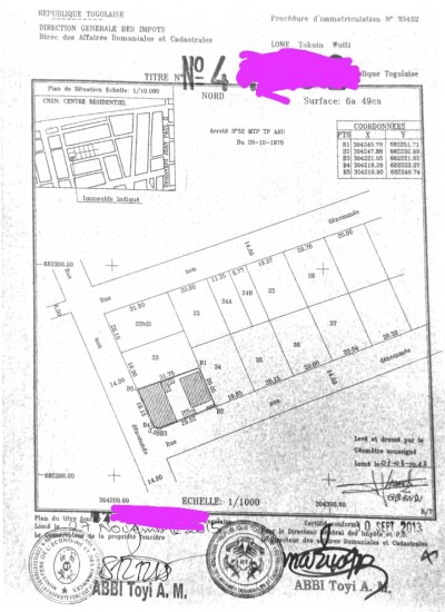 1 lot avec titre foncier  à 100m du goudron