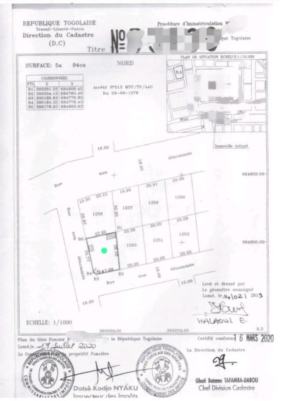 1 lot cloturé avec titre foncier à 20m du goudron